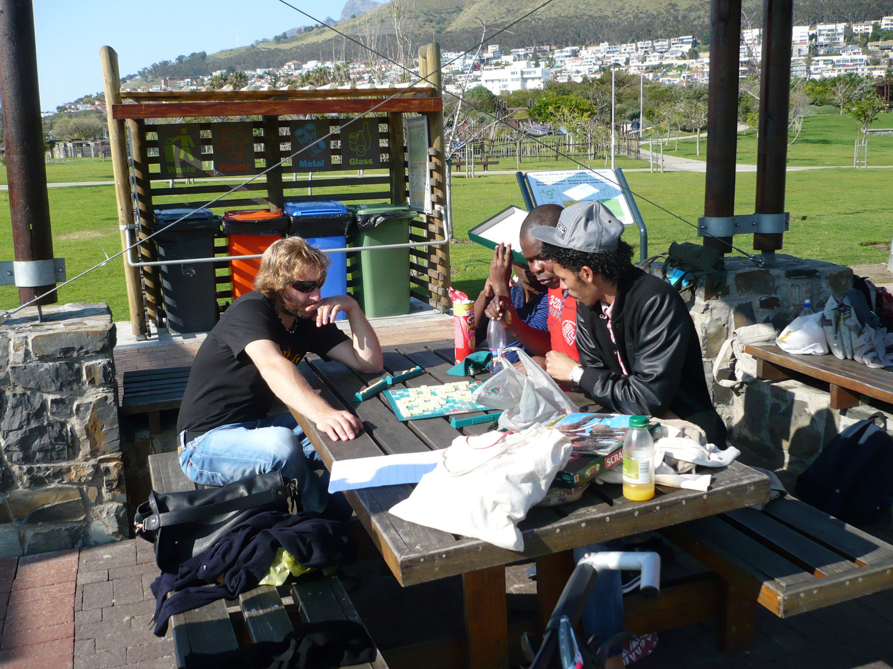 Language Learners in Green Point park playing a game with the slopes of Signal Hill Signal in the background.