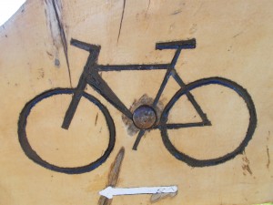 a woodcarving of a bicycle